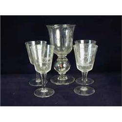 A large glass with a hollow knop containing a coloured glass huntsman and hounds