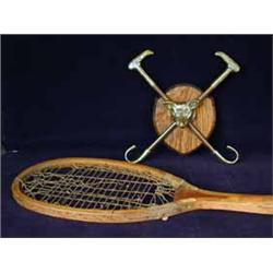 An early Slazenger tennis racket and a brass