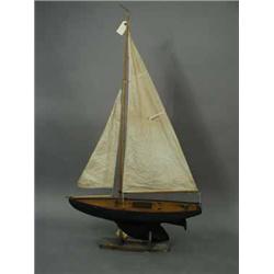 A wooden pond yacht