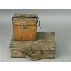 Two leather covered ammunition cases