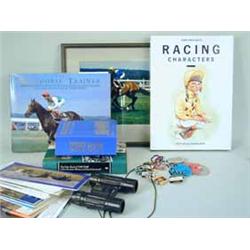 A box containing modern racing memorabilia including race cards