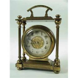 A late 19th century brass mantel clock