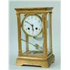 Image 1 : A lacquered brass and four glass panel mantel clock with an enamel dial and a mercury weighted pendu