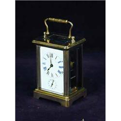 A small French brass carriage alarm clock
