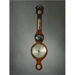 A George III inlaid mahogany wheel barometer