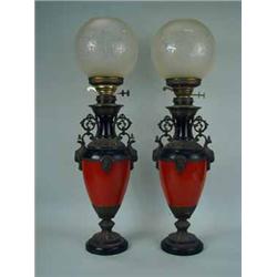A pair of Victorian oil lamps with etched glass shades