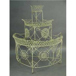 A Victorian wirework three tier demi-lune conservatory stand