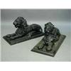 Image 1 : A pair of 20th Century composition figures of recumbent lions on iron plinths