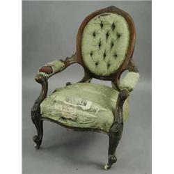 A Victorian walnut open armchair