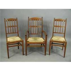 Three Arts and Crafts walnut dining chairs