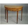 Image 1 : An early 19th century inlaid demi lune foldover mahogany card table