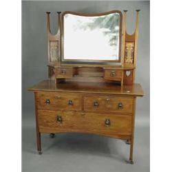 An Edwardian mahogany Art Nouveau inspired dressing chest