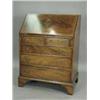 Image 1 : A reproduction mahogany bureau with a stepped interior