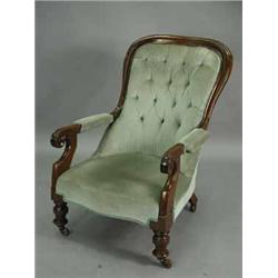 A Victorian button back armchair