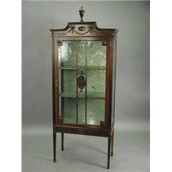 An Edwardian mahogany display cabinet with a single astragal glazed door