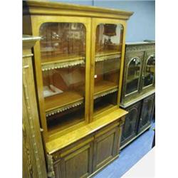 A late Victorian walnut bookcase with adjustable shelves