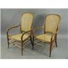 Image 1 : A pair of beechwood elbow chairs with caned backs and seats