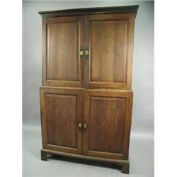 A 19th Century oak cupboard having four fielded panelled doors enclosing adjustable shelves