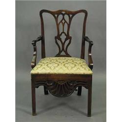 A George III Chippendale mahogany commode armchair Est.300/40