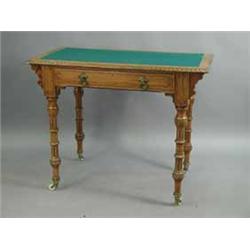 An Aesthetic movement pitch pine side table with a baize inset over a single frieze drawer