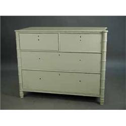 A white painted chest of drawers with imitation bamboo corners and mouldings