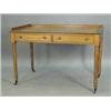 Image 1 : A Victorian oak writing table with a low 3/4 gallery over two frieze drawers and ring turned legs