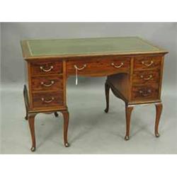 An Edwardian mahogany writing desk by Holland & Sons