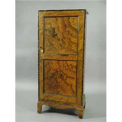 An unusual chest with grained decoration and a panelled door enclosing nine mahogany drawers