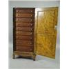 Image 2 : An unusual chest with grained decoration and a panelled door enclosing nine mahogany drawers