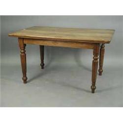 A 19th Century padouk wood dining table on tapering panelled legs