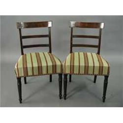 A set of six George III strung mahogany single dining chairs with bar backs