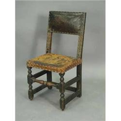 A l7th Century oak and leather single chair Est.200/30