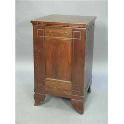 A l9th Century continental mahogany pedestal cupboard with a single panelled door