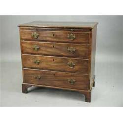 A George III mahogany chest of four graduated drawers