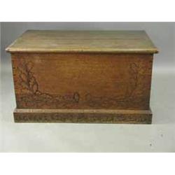 A l9th Century oak coffer carved with oak and ivy leaves