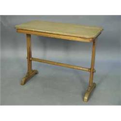 An oak Arts and Crafts stretcher table