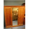 Image 1 : An Aesthetic movement pitch pine triple wardrobe with applied imitation bamboo mouldings.  Bears a H