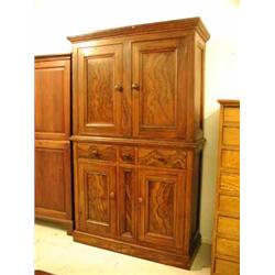 A l9th Century pine cupboard with painted grained walnut decoration having two panelled doors over t