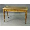 Image 1 : A Victorian oak two drawer writing table with turned reeded legs