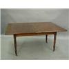 Image 1 : A mid 19th century mahogany dining table with a swivel fold-over top