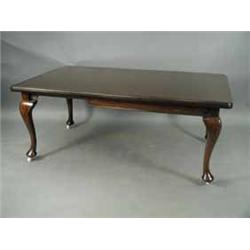 A Victorian mahogany extending dining table with one extra leaf