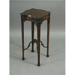 A mahogany kettle stand