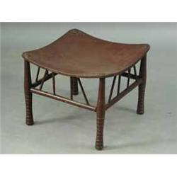 A painted Thebes stool with a dished plywood seat on turned legs Est.200/30