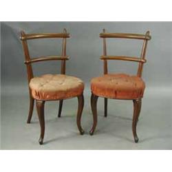 A set of six Victorian walnut single dining chairs with bar backs