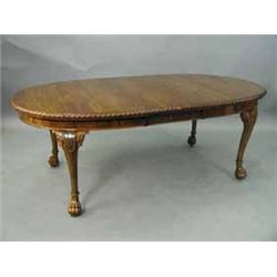 A 1930's walnut dining table