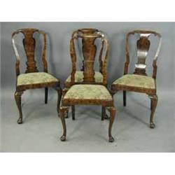 A set of seven walnut Queen Anne style dining chairs