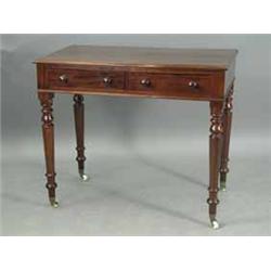 A Victorian mahogany side table with two frieze drawers