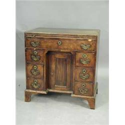 A George III mahogany caddy top knee hole desk