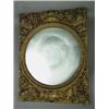 Image 1 : A 'gilt' wall mirror with a circular mirror and papier mache applied motifs. 116cm high Est.100/20