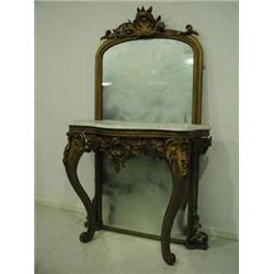 A carved wood pier table and mirror